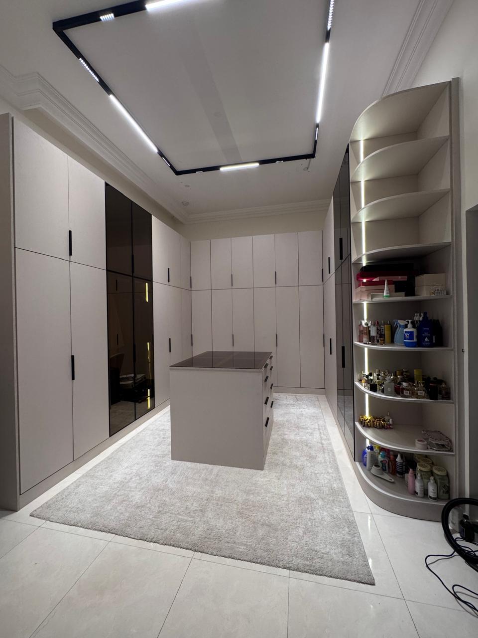 Modern kitchen cabinets Abu Dhabi with sleek white glossy finish